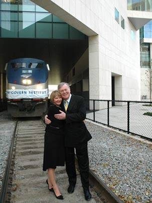 Lore Harp McGovern and Pat McGovern hug on the tracks that run under the brain and cognitive sciences complex, new home of the McGovern Institute for Brain Research at MIT. <a onclick="MM_openBrWindow('mcgovern-tracks-enlarged.html','','width=509, height=583')">
<span onmouseover="this.className='cursorChange';">Open image gallery</span>
</a>
<noscript> <a href="mcgovern-tracks-enlarged.html">...