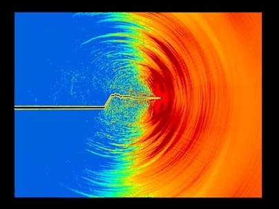 This atom-by-atom simulation shows a crack spreading through a brittle material. First the crack creates a clean slice across the surface, but as it gains speed it starts to gyrate, and the crack's path becomes increasingly uneven.