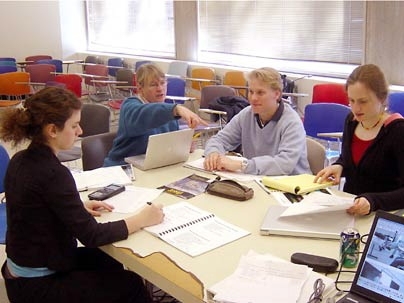 Four participants in the IAP session 'Energy: Science, Technology and Sustainable Development' work on their project. From left are MIT student Jacqueline Brazin; Cynthia Bloomquist, associate director of Corporate Relations, who took part in the class; Lars Appelquist, a graduate student in earth, atmospheric, and planetary sciences; and chemical engineering junior Ruth Misener.