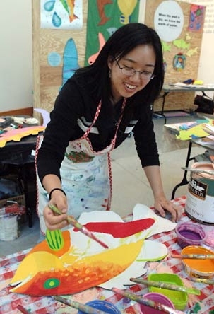 Freshman Esther Chung of architecture and urban planning works on a fish late last month for the 'S.O.S.-Fish' installation at Stata.