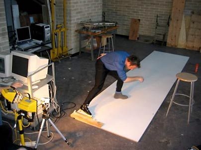 Rob Kramer, co-founder of Okolo Sports Technologies, tests out the Fulcrum Clapskate on a slideboard at MIT. MIT Experimental Projects Lab students recorded skating movements with a high-speed video camera to test the skates' design.