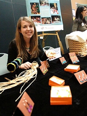 Sophomore Alia Whitney-Johnson displays some of the beaded jewelry she is selling to help young rape and incest victims in Sri Lanka. She set this table up at the March 3 MacVicar Day celebration at the Stata Center. Whitney-Johnson, a civil and environmental engineering major, taught the girls to make the jewelry.
