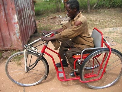 MIT graduate student Amos Winter and local technicians adapted this three-wheeled vehicle for use by the disabled. It is powered by a hand crank.