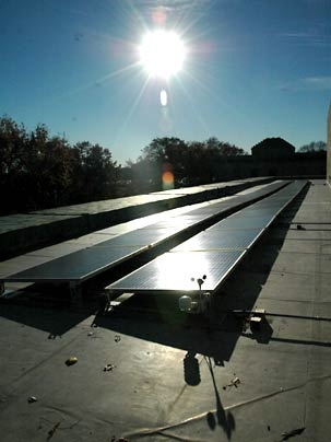 Solar panels on top of the Hayden Memorial Library soak up the afternoon sun on Monday, Nov. 14, 2005, the day MIT celebrated the completion of its largest solar installation. The Energy Research Council's report calls for MIT to continue to improve campus energy management.