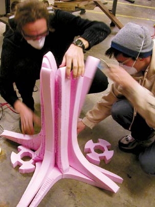 Achitecture postdoctoral associate Axel Kilian, left, works with graduate student John Snavely on an early prototype for the 'Muscles' mini-skyscraper.