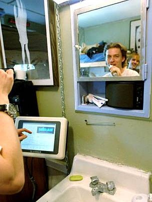 Freshman Zack Anderson can check the weather at the monitor by the sink in his fully automated dorm room.