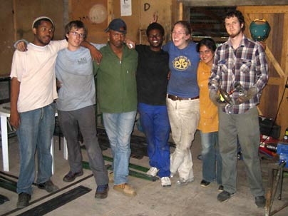 Keketso Khuele of Lesotho, MIT junior Charlie Hogg, Lehlohonolo Mpholo of Lesotho, Tumelo Makhetha of Lesotho, MIT seniors Monica Lewis and Mubarik Imam, and graduate student Matthew Orosz take a break from working on the new micro-generator in Lesotho in January.
