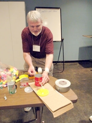 Ken Gay, sixth-grade science teacher in Stoughton, made this 'popper,' which pops balls out of can, July 12 while participating in the Museum Institute for Teaching Science at the MIT Museum.