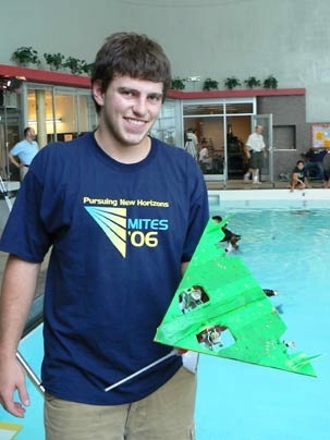 Max Mitchell of Las Vegas holds his team's entry in the underwater robot competition held in the Alumni Pool on July 28, the finale of this year's MITES program. His team, Los Pepos, won the underwater Quidditch match, but not the overall robot competition. <a onclick="MM_openBrWindow('mites1-enlarged.html','','width=509, height=583')">
<span onmouseover="this.className='cursorChange';">Open imag...