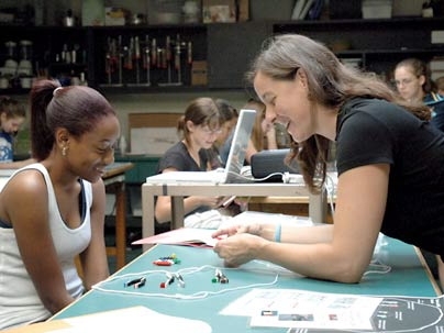 Sherianna of Hyde Park, Mass., works with Amy Fitzgerald
  of the Edgerton Center during the You Go Girl! program Aug. 2.