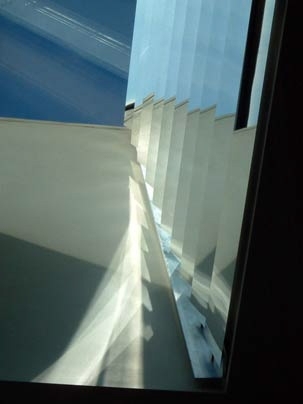 Detail of a skylight designed to redirect and optimize daylight in Marilyne Andersen's MIT office. The assembly includes aluminum slats of varying inclination angles that maximize daylight penetration into the office space while avoiding reflections on the computer screen -- and creating interesting visual effects.