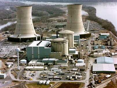 The two containment buildings (center) and two of the cooling towers (background) of the Three Mile Island nuclear power plant.