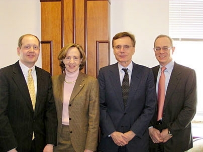 Glenn Ellison, left, President Susan Hockfield, Gregory K. Palm, and Provost Rafael Reif celebrate Ellison's appointment.