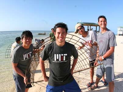 First Step Coral team members hold a Biorock module. Left to right: Emzo de los Santos '09, Gerardo Jose la O' (MIT graduate student), Martin Lorilla '09, and Illac Diaz (MIT SPURS Fellow).