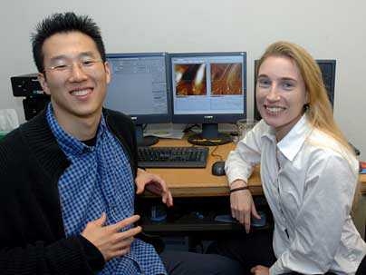 Graduate student and lead author Sunyoung Lee and Professor Krystyn Van Vliet in the lab with images of cell surfaces on the monitor behind them.