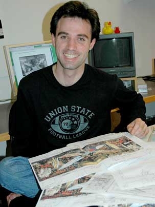 Ben Wood, a second-year graduate student in visual arts in the Department of Architecture, with some of his notes on Diego Rivera's mural "Man at the Crossroads."