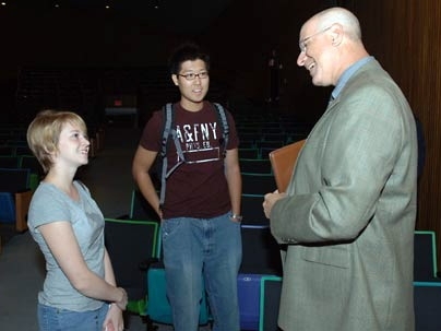 Freshmen Emma McKinney, left, and Sun Kim, center, came up to meet Professor Richard Samuels following his keynote address to freshmen on Tuesday morning.