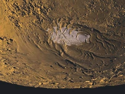 This image of Mars' south polar region shows the ice cap (in white) within the smooth polar layered deposits that overlie the cratered southern highlands.