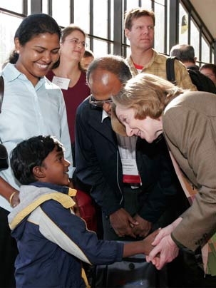 President Hockfield greets young Siva Sambasivam of Sarasota, Calif., who came with his mother, Nachiyar, and father, Chidambara, to Family Weekend, Oct. 12-13, to visit his sister, freshman Sivakami.