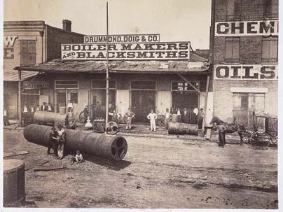 Theodore Lilienthal's photos, examined in a new book by MIT's Gary Van Zante, presented post-war New Orleans businesses as good investment opportunities, bustling yet orderly. Pictured here is the Drummond &amp; Doig Foundry. <a onclick="MM_openBrWindow('nola-boiler-enlarged.html','','width=509, height=583')">
<span onmouseover="this.className='cursorChange';">
<strong>Open image gallery</strong...