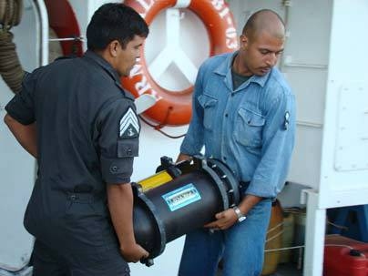 An acoustic sensor key to joint MIT-Mexico hurricane research is deployed off the coast of Isla Socorro by crew members of the Mexican Research Vessel Altair.