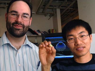 Michael Strano, associate professor of chemical engineering at MIT, and graduate student Chang Young Lee, right. Strano and his team have built a highly sensitive detector, here held by Lee, using carbon nanotubes that can sense very small quantities of neurotoxins.
