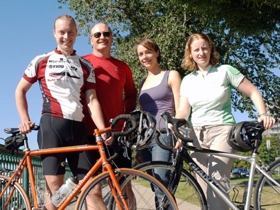 From left, Travis Franck, John Reilly, Valerie Karplus and Noelle Selin, all of the Center for Global Change Science at MIT, pose with their bicycles on Memorial Drive. The four will be part of an MIT group partaking in a ride for climate change awareness from New York City to Washington, D.C.