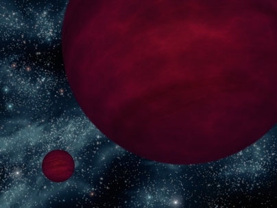 This artist's concept shows the dimmest star-like bodies currently known -- twin brown dwarfs referred to as 2M 0939. The twins, which are about the same size, are drawn as if viewed from one side.