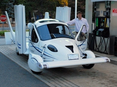 The TransitionÂ® Roadable Light Sport Aircraft Proof of Concept runs on premium unleaded auto gas. Carl Dietrich, CEO/CTO is shown with the TransitionÂ®.