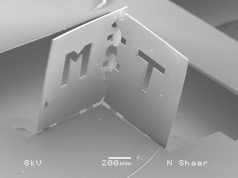 A team of MIT researchers folded this polymer sheet into one corner of a cube. The edge of each face is about 800 microns.