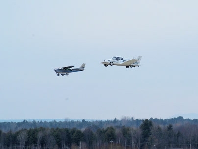The Terrafugia Transition flying in formation with the chase aircraft.