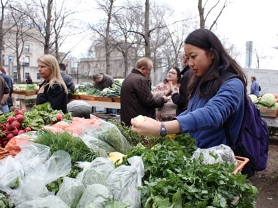 Kelly Ran, a sophomore in the Department of Mechanical Engineering, shops at East Campus' new produce stand during its first day of operation on March 31.