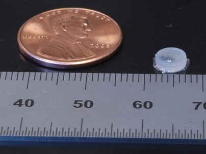 MIT researchers have developed a device, right, that can be implanted into a tumor to monitor how it responds to treatment.