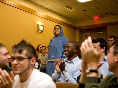 Course X teaching assistant Jamila Saifee learns she has won theEdward W. Merrill Outstanding Teaching Assistant Award.