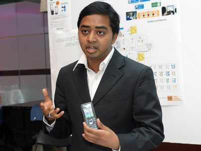 MIT graduate student Swami Sekar, whose team for Nextlab created mobile technology, called Celedu, to increase literacy and education, speaks at poster session at Media Lab.