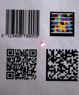 The Bokode device, at center, is much smaller than other types of
barcodes, yet can contain far more information.