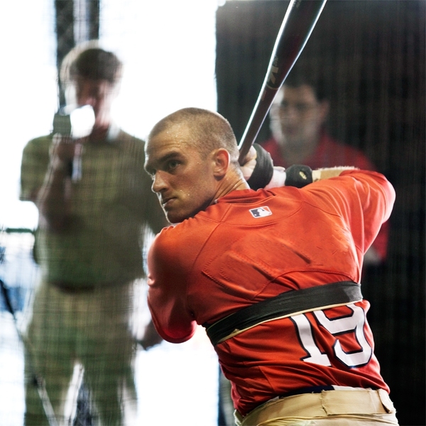 A player at the Boston Red Sox preseason training camp is wired with sensors developed by the MIT Media Lab, which gauge the forces he exerts when he swings the bat.