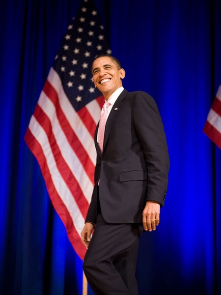 President Obama walks across the stage before his remarks in Kresge Auditorium.