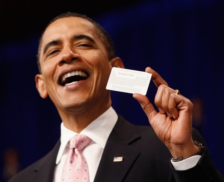 President Barack Obama holds up a card with the periodic table of elements on it, given to him by one of MIT's researchers.