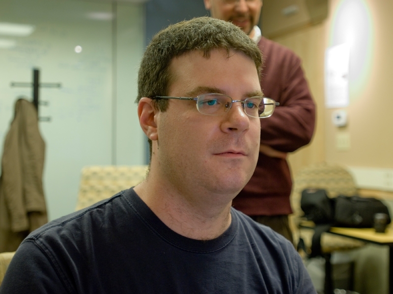 Jason Begy, a graduate student in the Comparative Media Studies program and a GAMBIT researcher, plays 'Pierre' in the Game Lab offices.