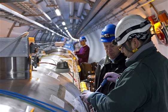 Workers examine a new Quench Protection System at CERN in January.