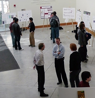 Presenters and visitors at the NSE Graduate Research Expo poster session.