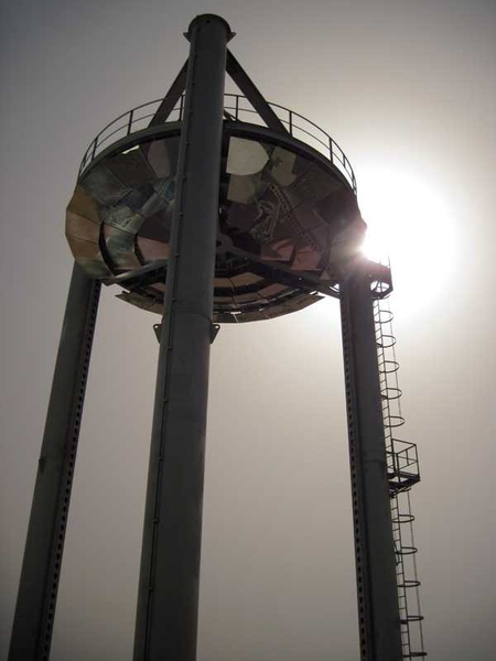 Known as the Beam Down Project, this small, experimental solar farm at the Masdar Institute has ground solar collectors that reflect light to the central, aerial reflector. That reflector then directs the beams to a ceramic plate located at ground level that measures the amount of energy generated from the sunlight. 