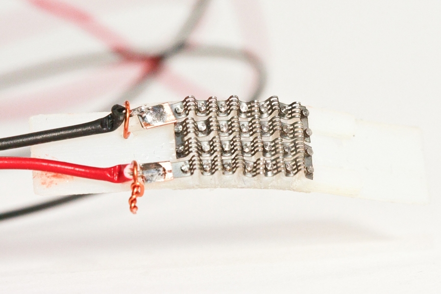 Different configurations of the actuators cause different types of motions. Here, charging the actuators causes a plastic joint to fold in half.