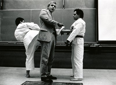 In this 1991 image, Michael Feld, center, is shown demonstrating the physics of karate with his twin sons, Jonathan and David.