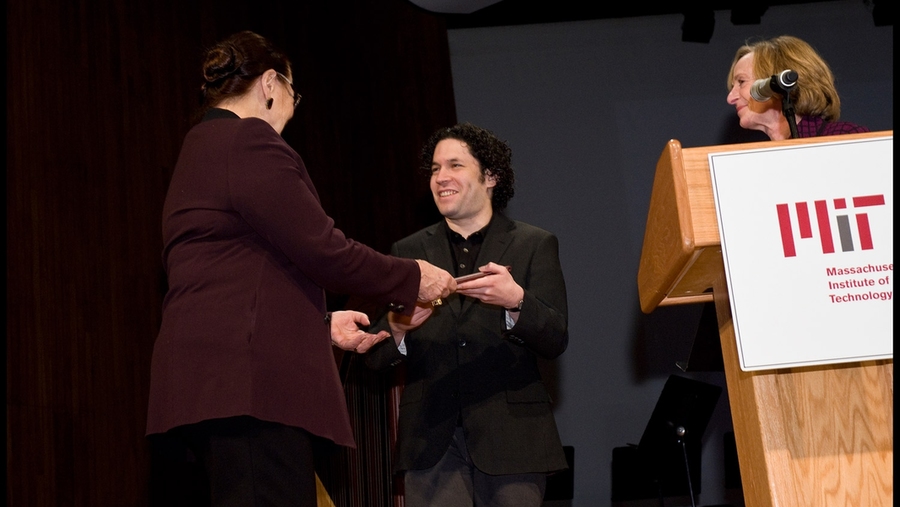 Council for the Arts Chair Brit d'Arbeloff MIT '61 presents the 2010 McDermott Award in the Arts to Gustavo Dudamel, as MIT President Susan Hockfield looks on.