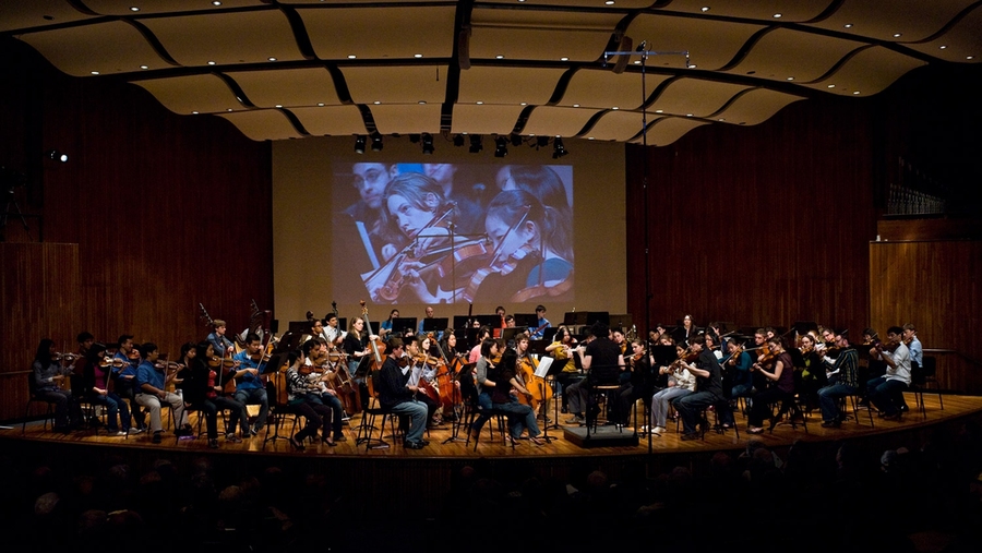 Projectors helped the overflow Kresge Audience see the students respond to McDermott Award winner Gustavo Dudamel's direction.