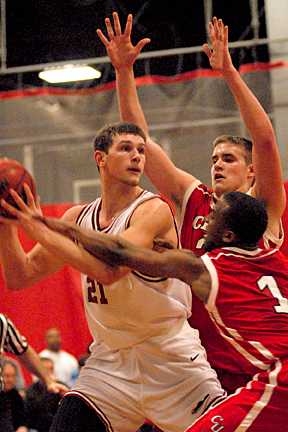 Freshman forward Will Tashman looks to pass against Clark University.
