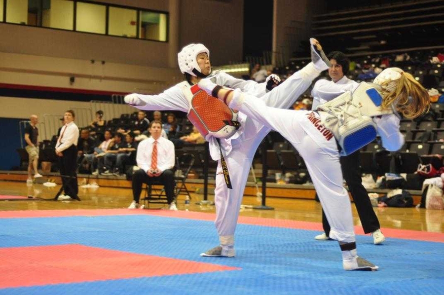 Sophomore Erika Lee throws a high kick en route to a silver medal in the women's black belt welterweight division.