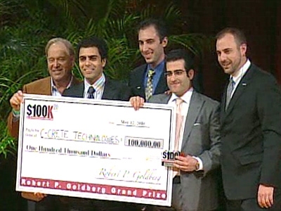 C-Crete co-founders Rouzbeh Shahsavari (second from left) and Natanel Barookhian (second from right) are awarded the $100,000 grand prize by keynote speaker Paul Fireman (far left), former CEO of Reebok, and $100K Managing Director Daniel Vannoni (center) and Associate Director Jarrod Phipps (right) at the competition finale at Kresge Auditorium. 